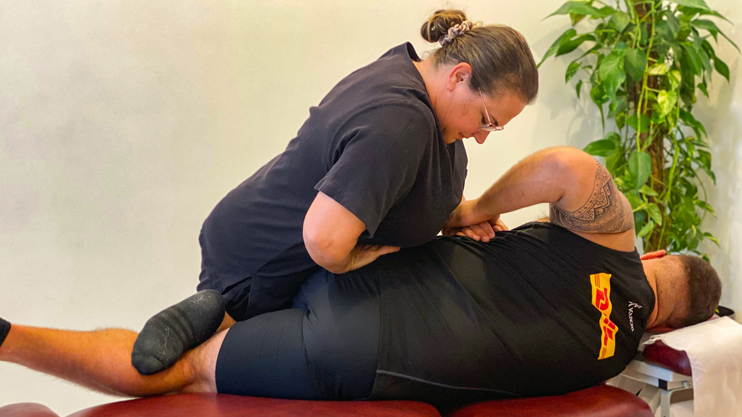 A chiropractic adjustment being performed at InTouch Clinic