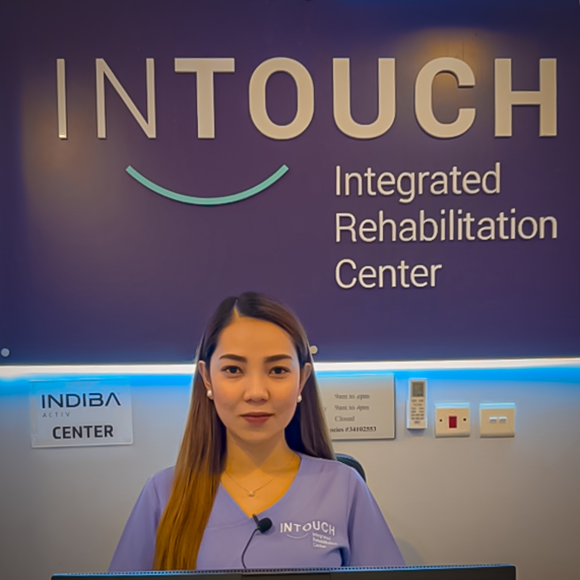 Reception at InTouch Clinic beneath the InTouch Integrated Rehabilitation Center sign