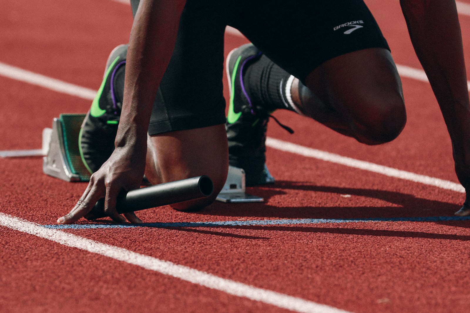 A sprinter set in the starting blocks